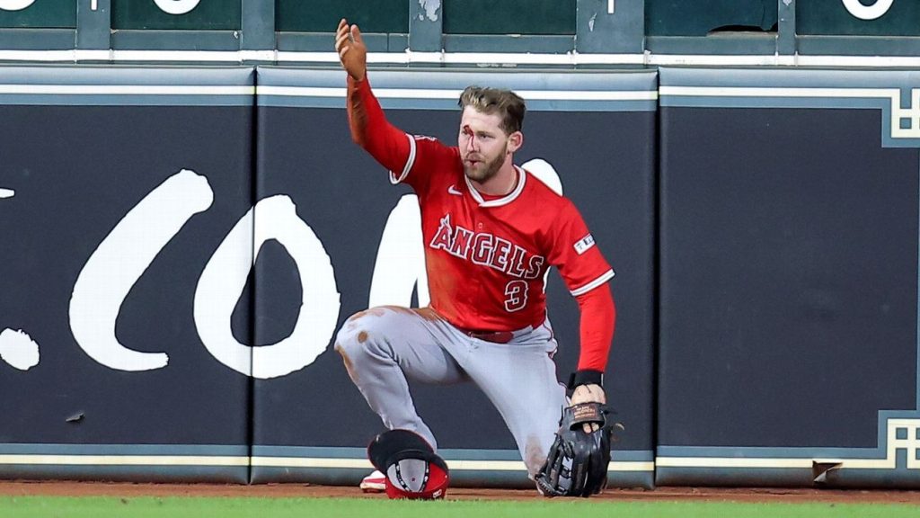 Angels’ Taylor Ward carted off after crashing into scoreboard Copy Link