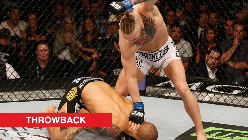 Conor McGregor lines up a punch after flooring Dustin Poirier at UFC 178 in 2014