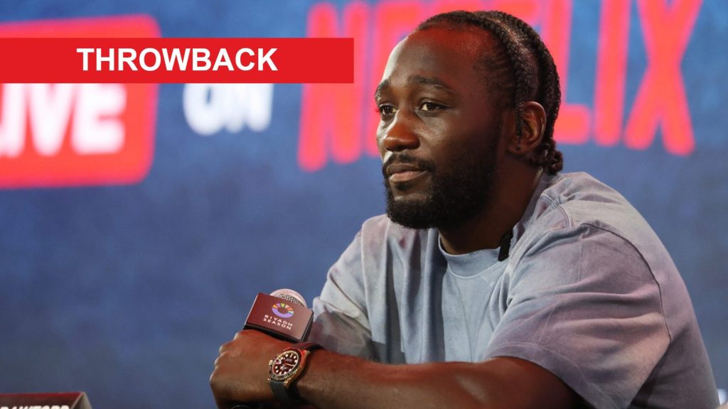 Terence Crawford on stage at a press conference at Fanatics Fest, inset throwback banner