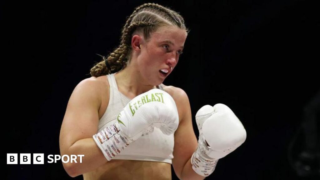Francesca Hennessy in the ring with white gloves on