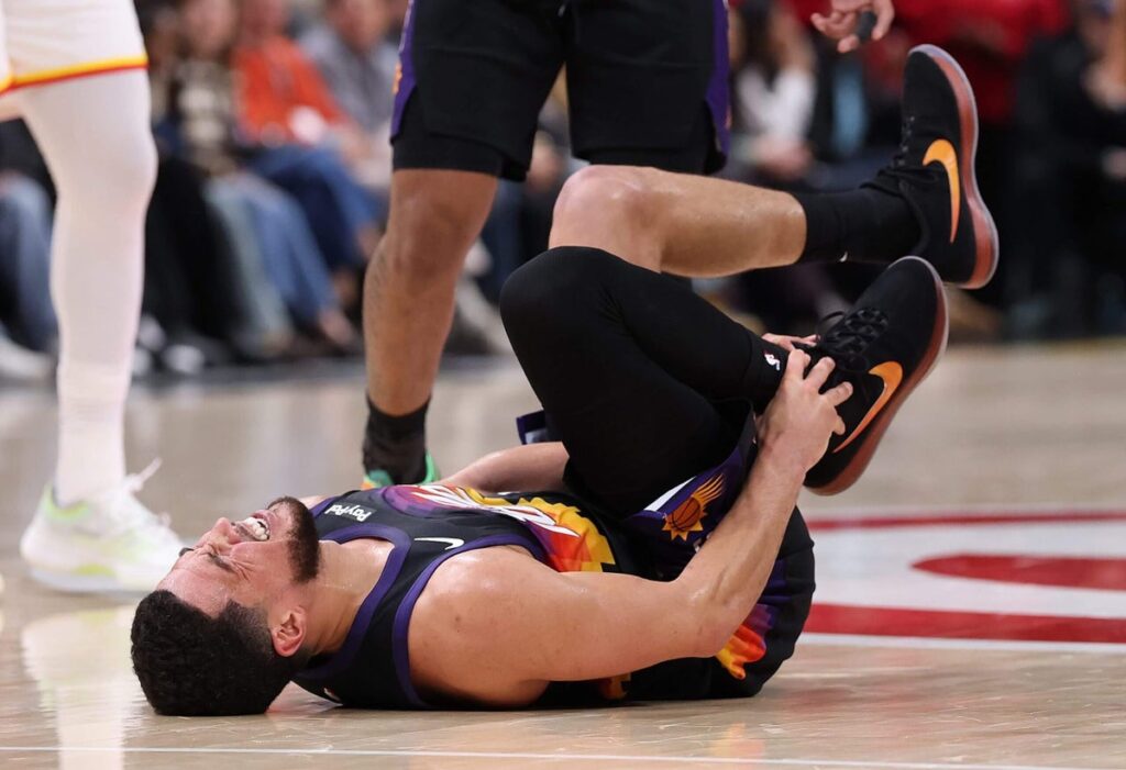 Suns star Devin Booker to miss at least a week with ankle injury