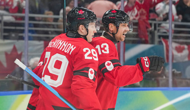 Canada Set to Take on USA in Gold Medal Game Sam Reinhart (13) of Canada celebrates with Nathan MacKinnon (29) after scoring a goal.