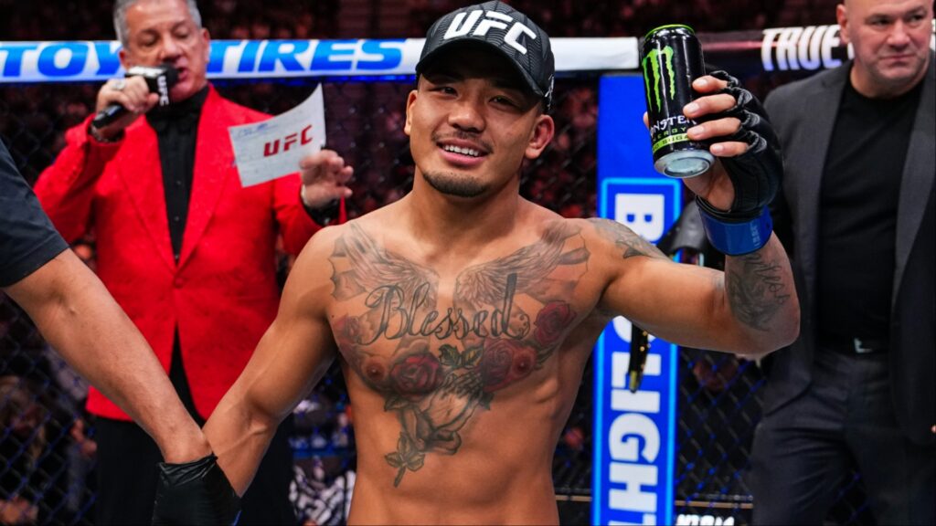 Joshua Van celebrates as the official decision is read at UFC 323