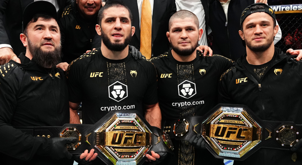 Arman Tsarukyan plans to double Khabib Nurmagomedov’s UFC title defense tally as champion Islam Makhachev and Khabib Nurmagomedov, with Usman Nurmagomedov and a coach either side of them, hold Makhachev's two UFC belts
