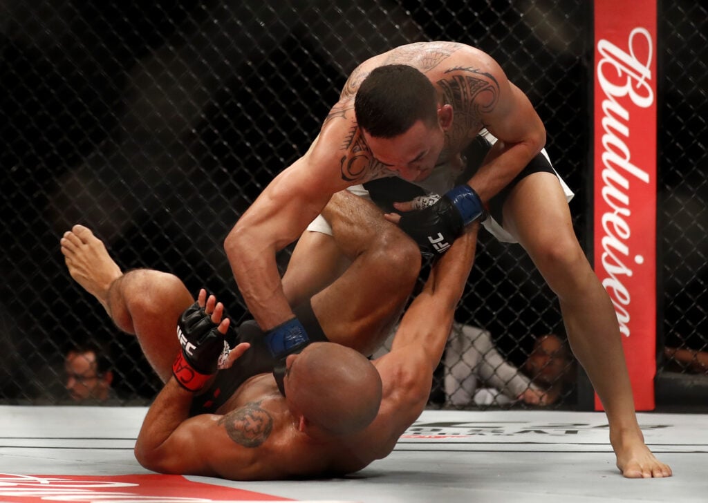 Comparing Charles Oliveira’s and Max Holloway’s 9 rematches with undefeated record on the line Max Holloway punches Jose Aldo at UFC 212