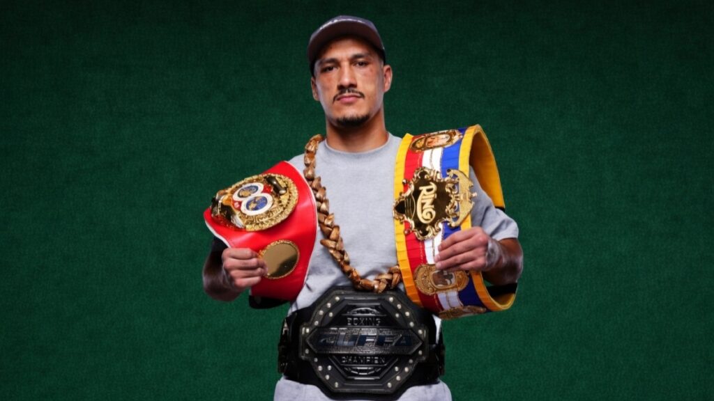 Jai Opetaia holding the IBF, Ring and Zuffa cruiserweight championship belts