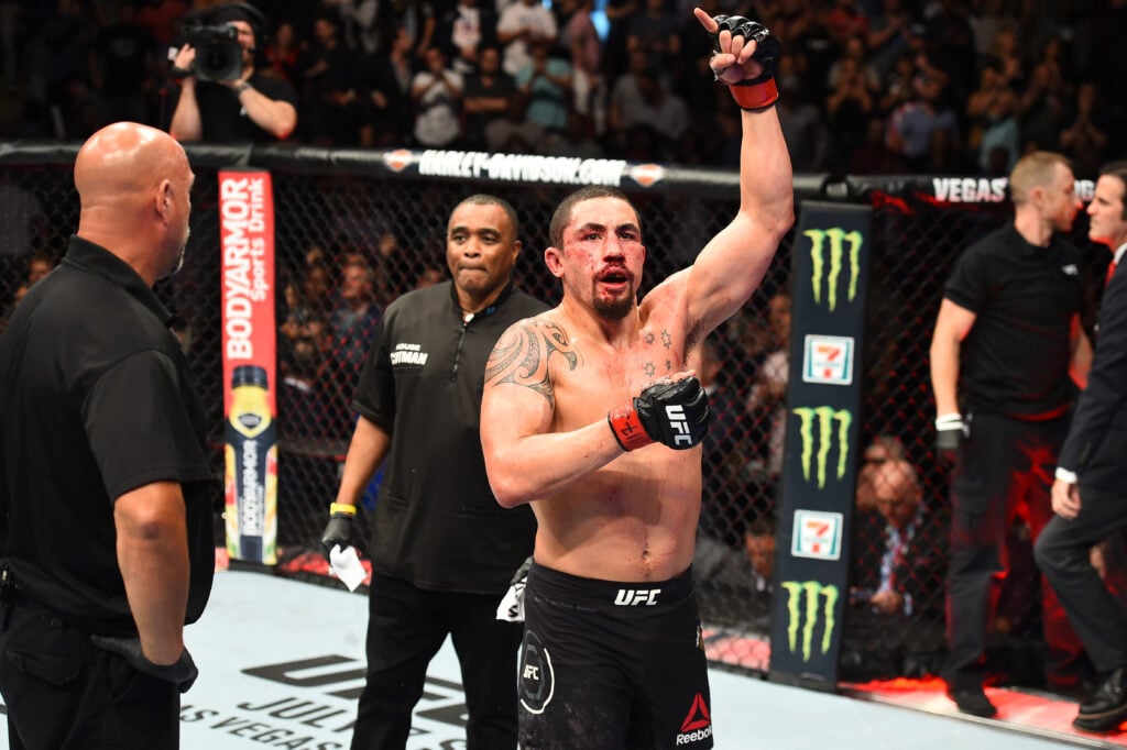 Robert Whittaker reacts to his first prelim spot in 13 years on Conor McGregor’s UFC 329 return card Robert Whittaker raises his hand after facing Yoel Romero at UFC 225