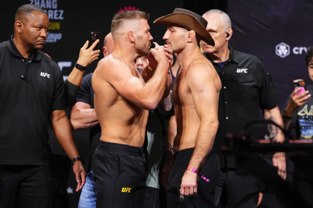 Sean Strickland dismisses Dricus du Plessis trilogy for now: “I don’t think sitting out on the sidelines gets you a title shot” Dricus du Plessis and Sean Strickland staredown before UFC 312