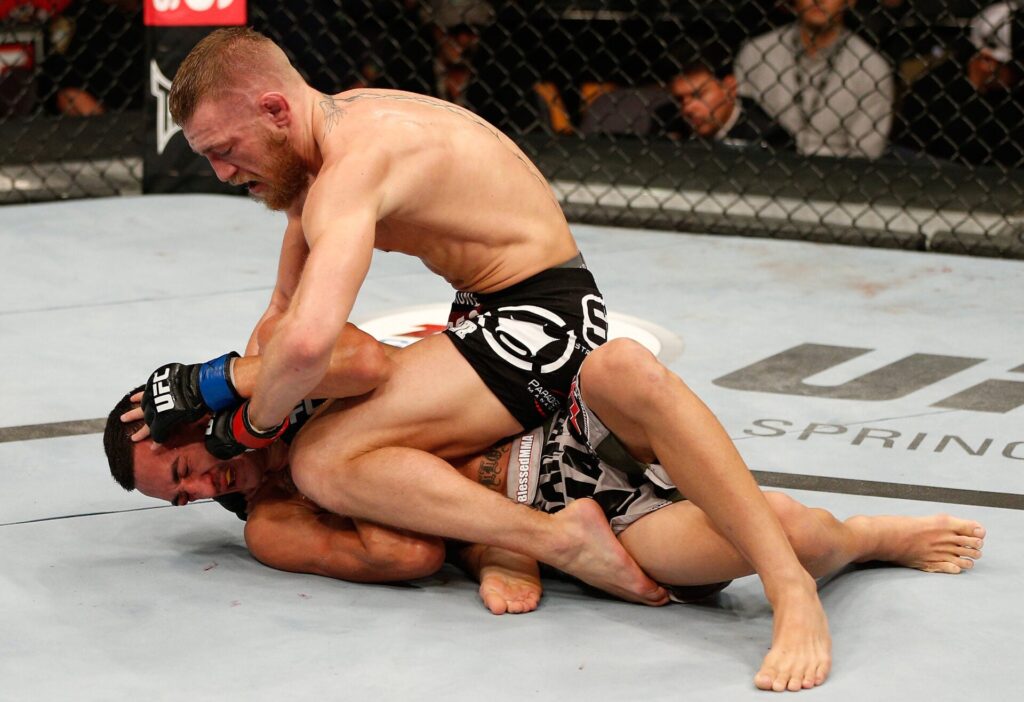 Why timing might actually be Conor McGregor’s best friend despite his 5-year layoff before UFC 329 Conor McGregor on top of Max Holloway during their 2013 fight