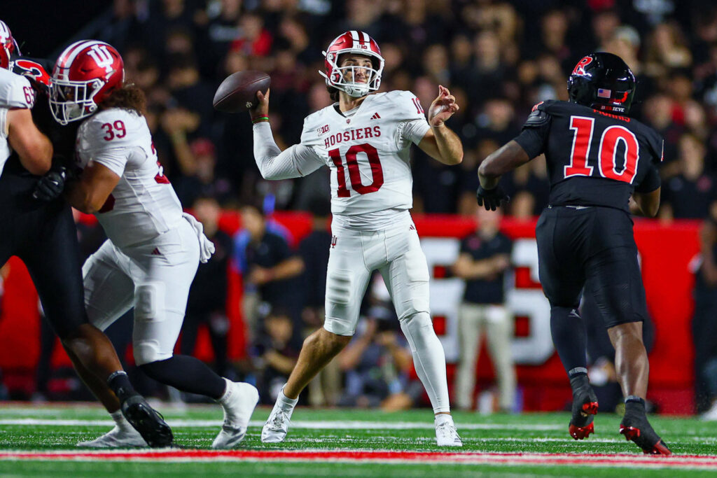 Score Predictions for Every Game College football AI predictions, Indiana Hoosiers quarterback Josh Hoover (10) throws the ball.